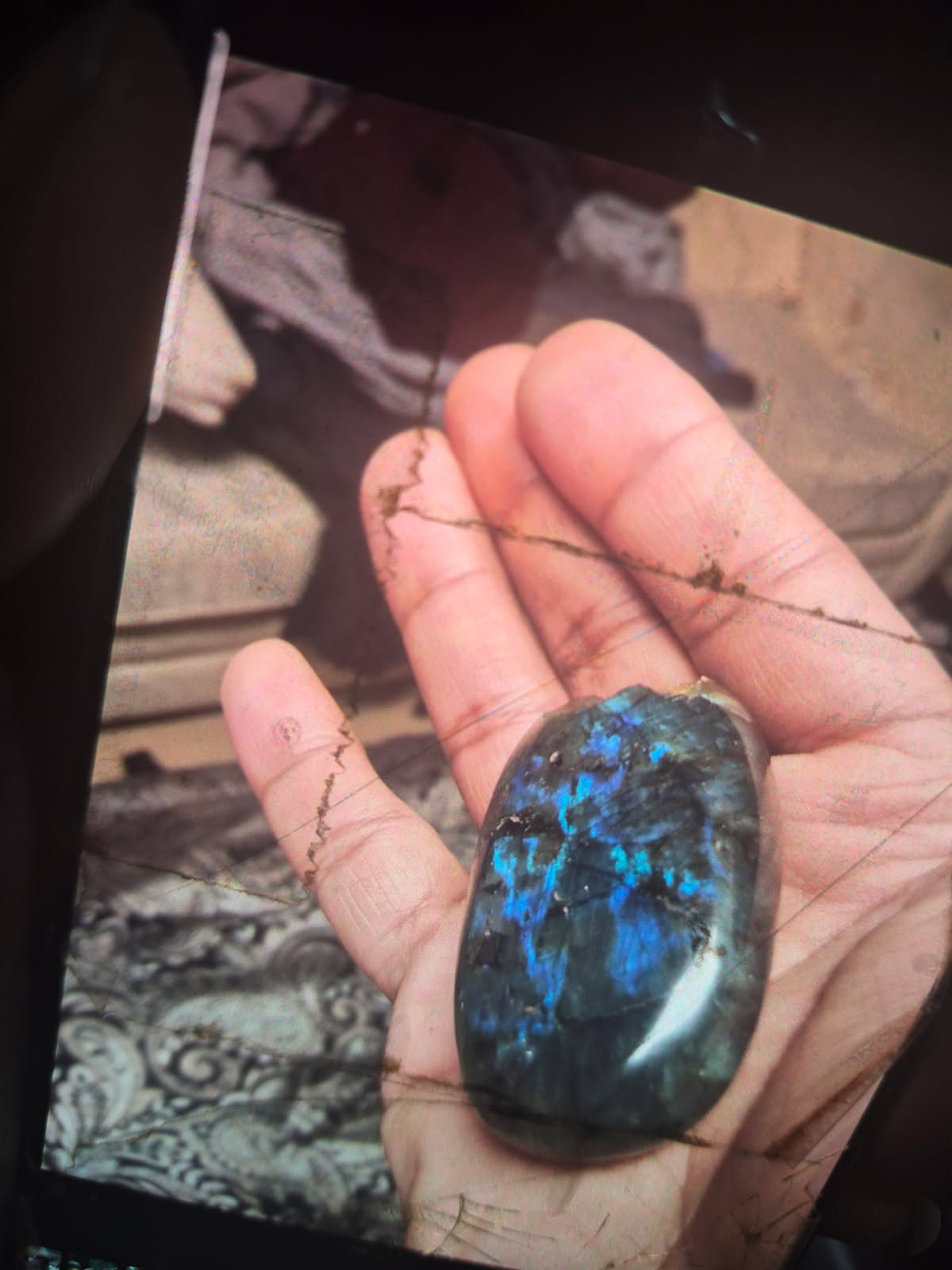The labradorite in the hand, a second angle