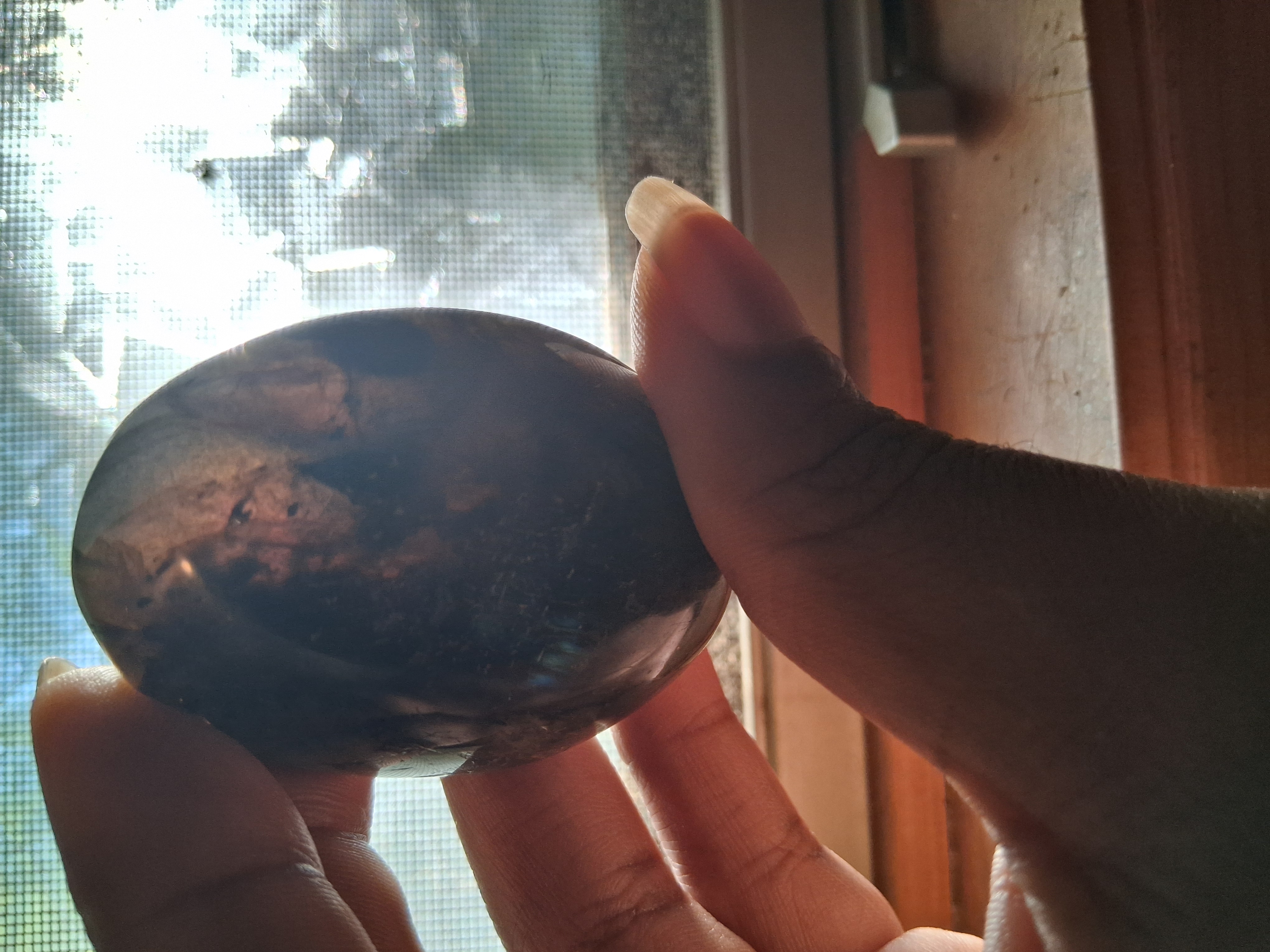 A dark stone, mottled through