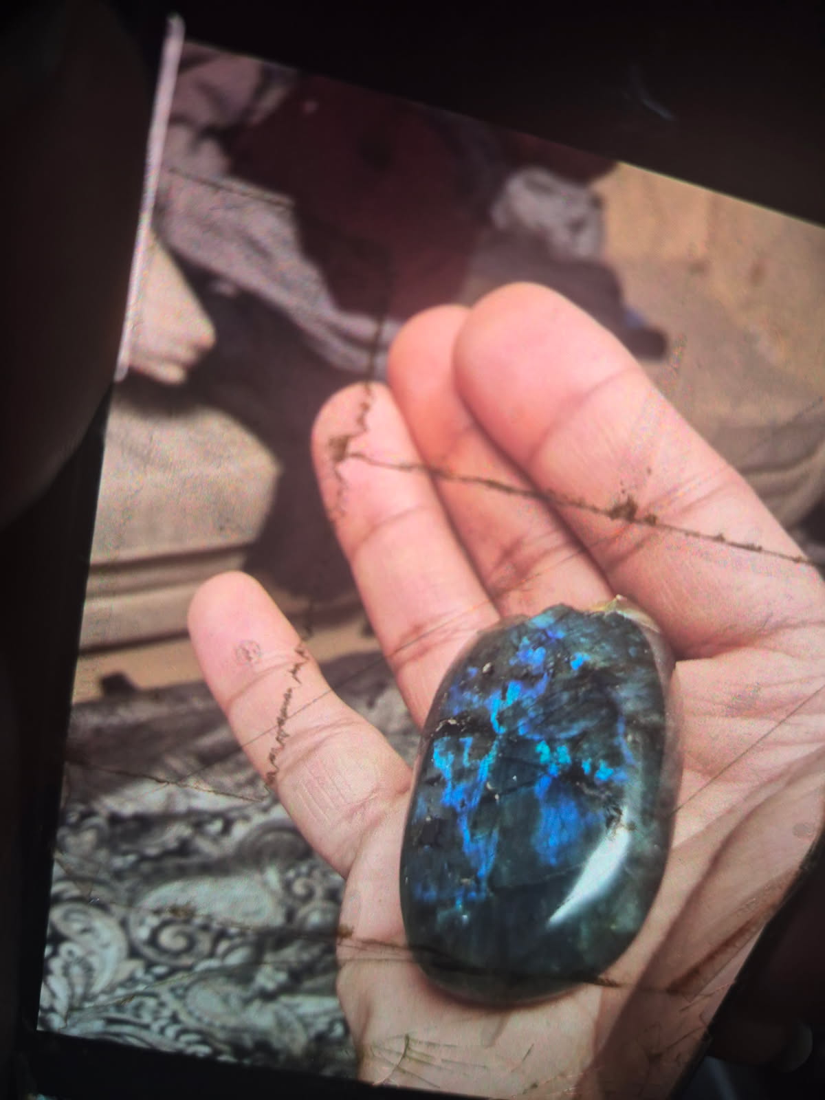 The labradorite held up to the light