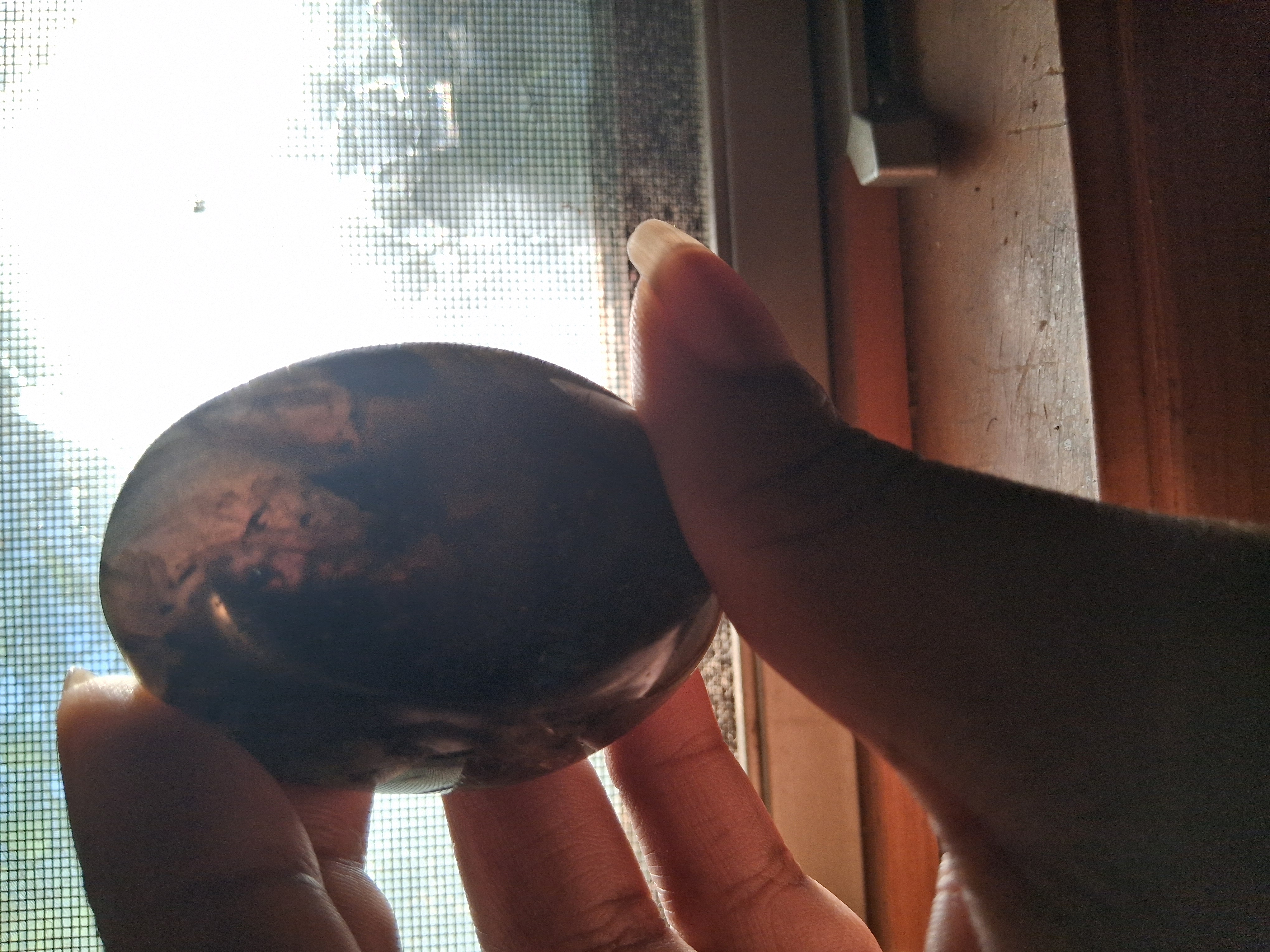 A dark brown and black stone