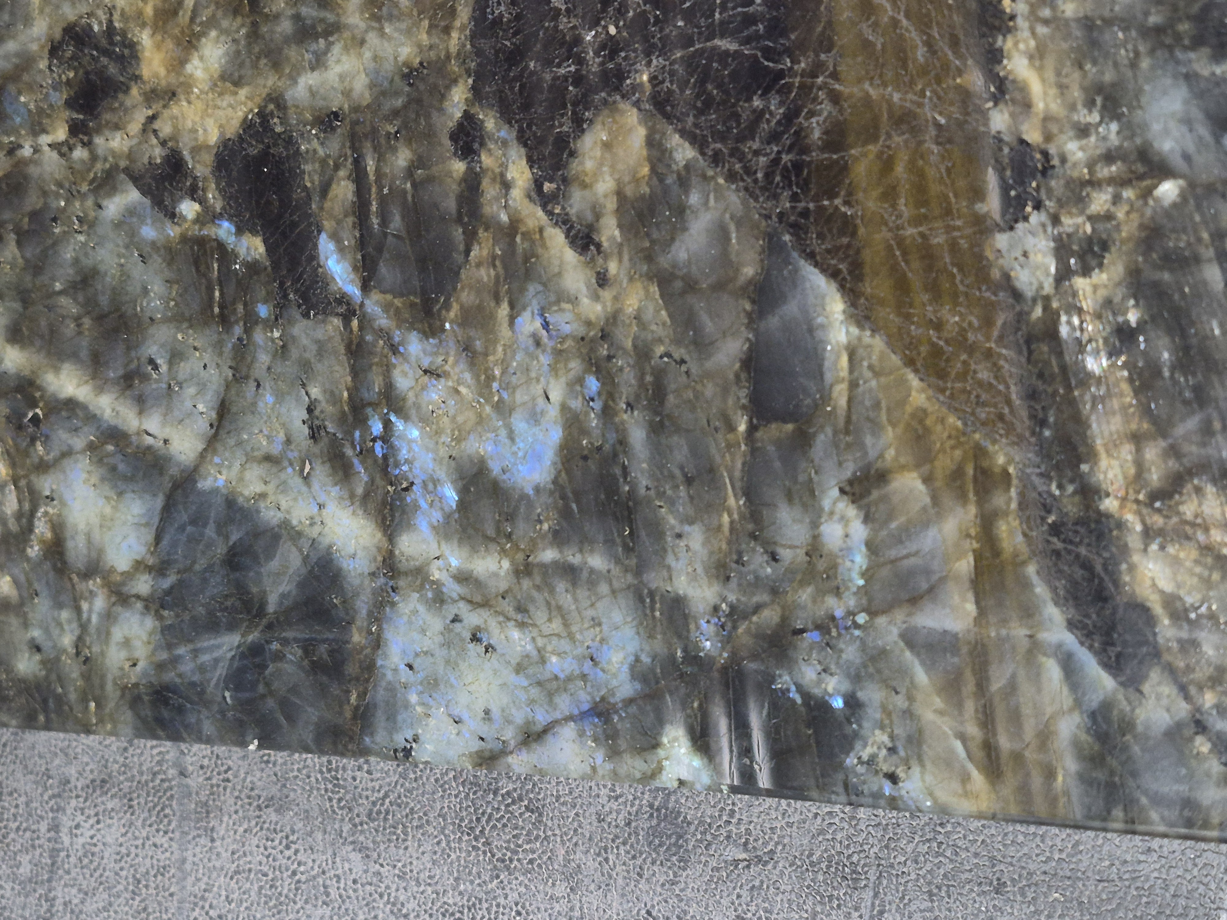 A labradorite slab, fractured and veined