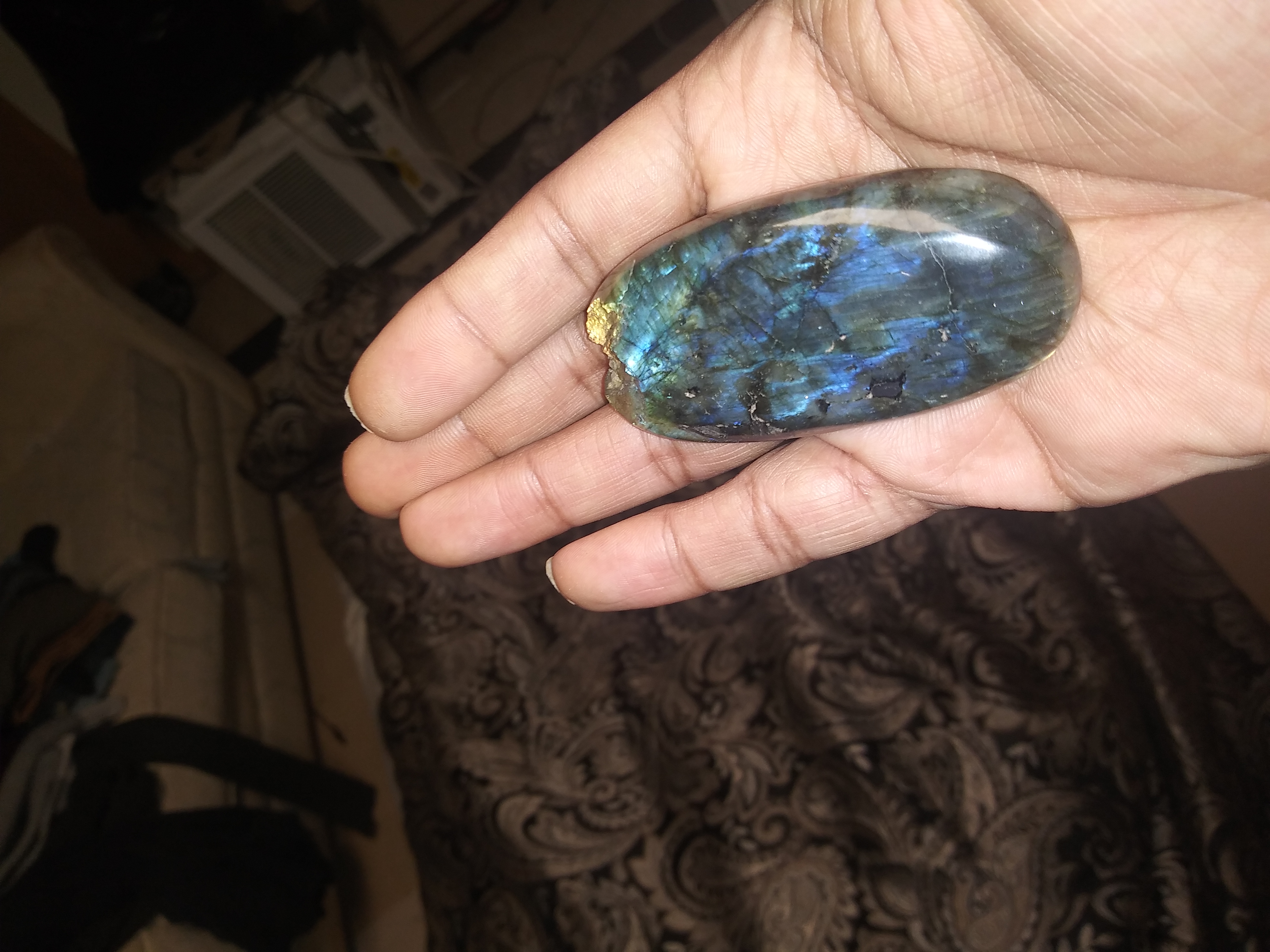 The oval, blue and green in the hand