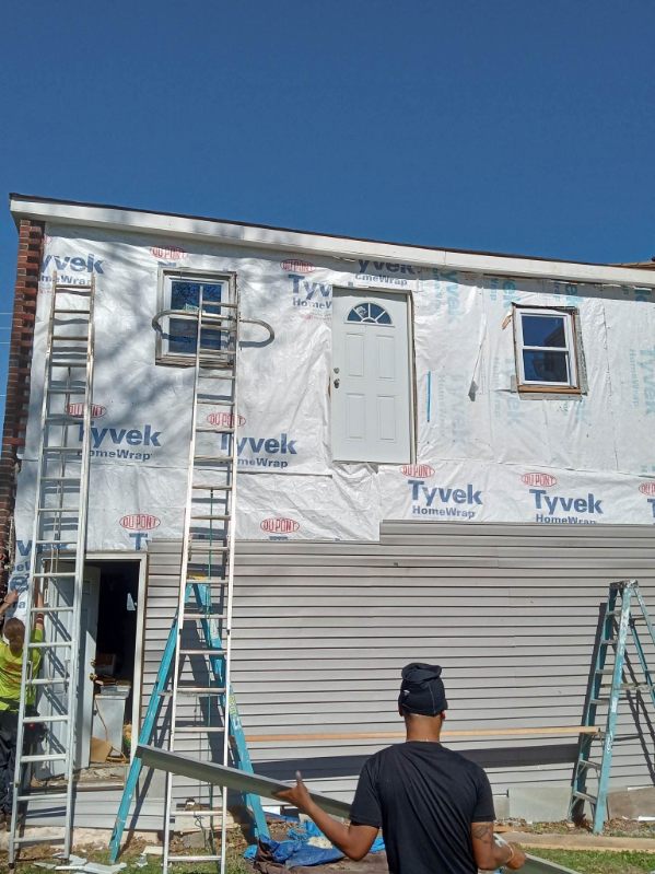 Siding and weather barrier going on